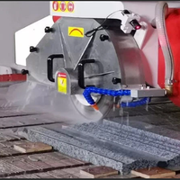 Bridge saw cutting stone slab in working process Bridge saw cutting stone slab in working process